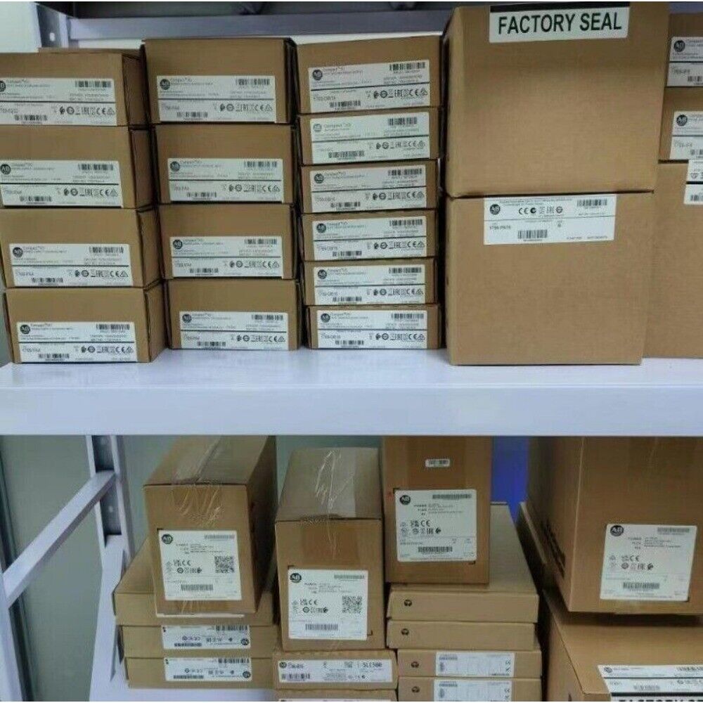 Allen-Bradley PowerFlex 40 AC Drive boxes, factory sealed, brown cardboard packaging, product labels.