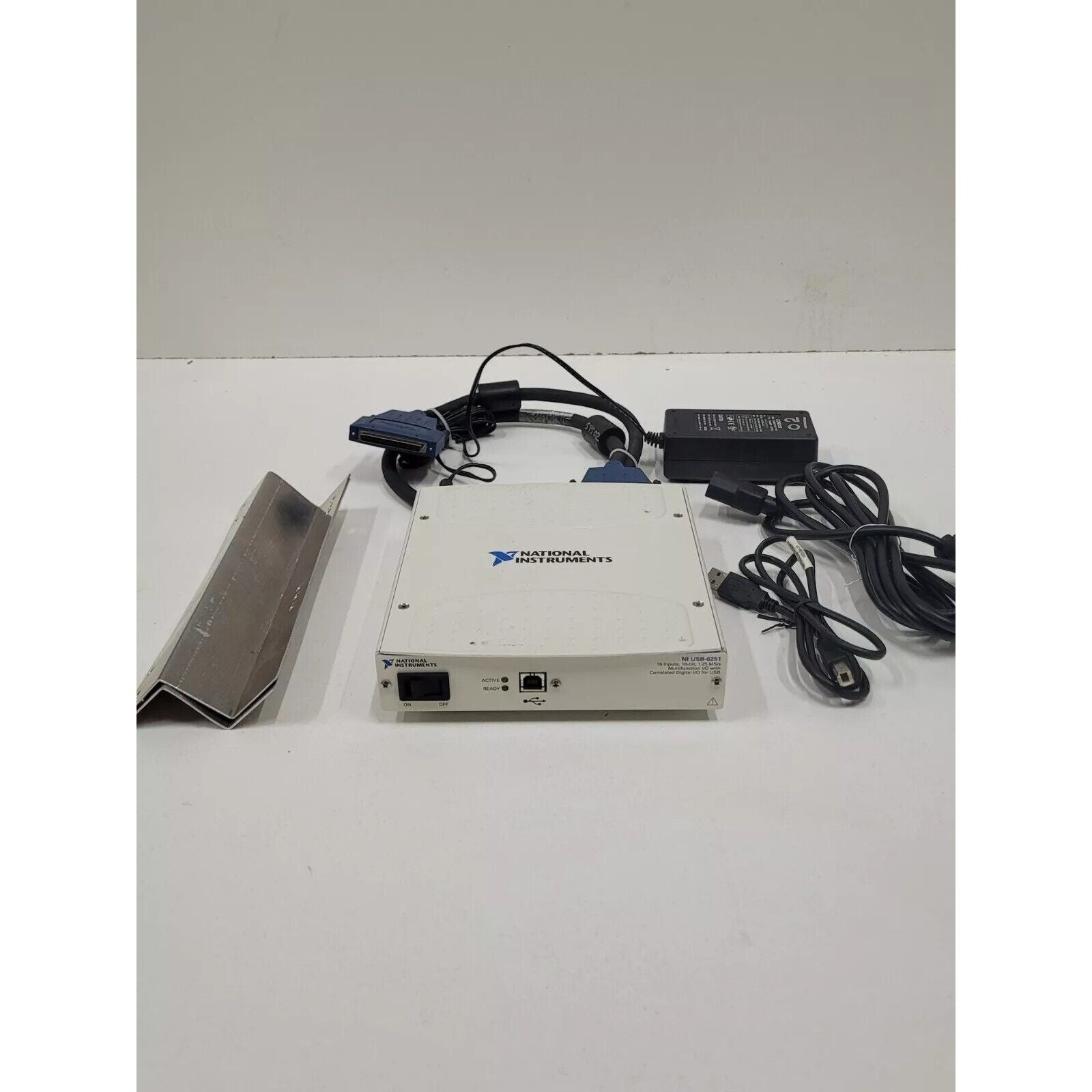 National Instruments USB-6251 Multifunction I/O device with cables and power supply, industrial automation equipment.