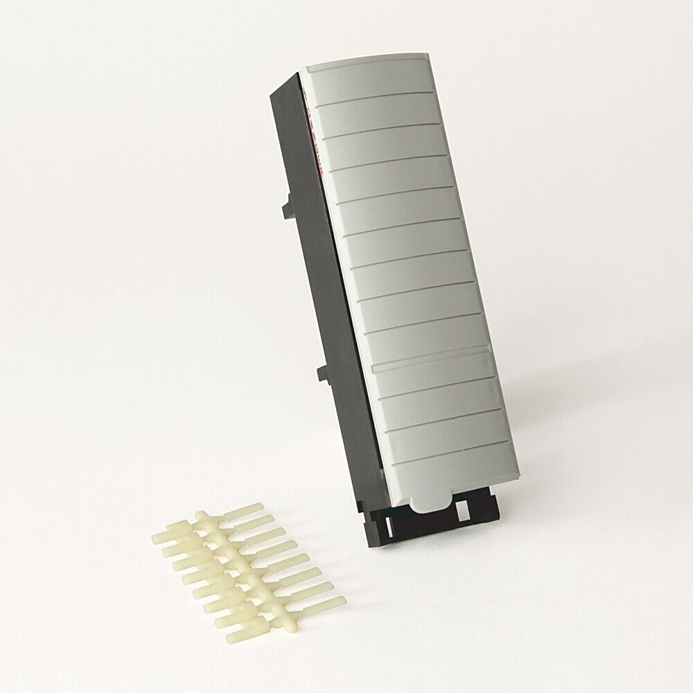 Allen-Bradley 1756-TBSH PLC module with gray face and cream-colored pins. Industrial automation component.