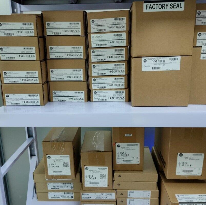 Allen-Bradley PLC modules in boxes, warehouse storage, factory seal visible
