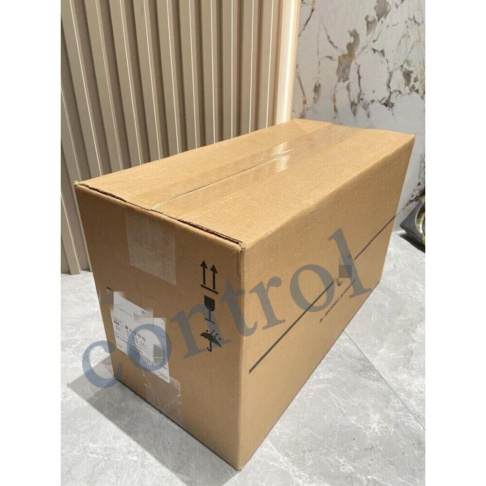 Allen-Bradley PowerFlex 70 AC Drive in shipping box, fragile handling label, PLC product