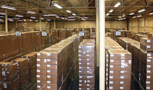 Industrial automation parts warehouse with stacks of boxes, products ready for shipment, from Radwell International.