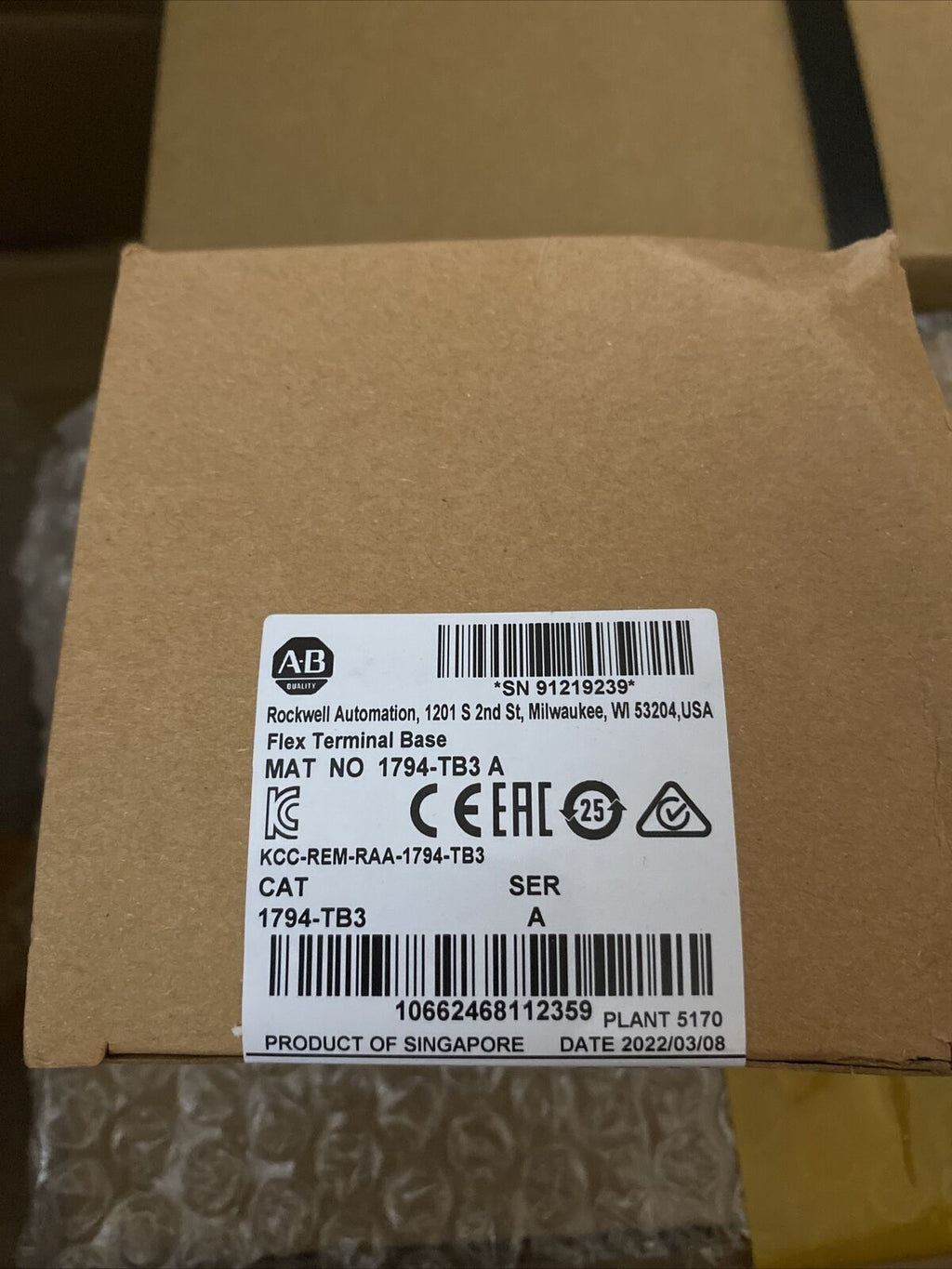 Allen-Bradley 1794-TB3 Flex Terminal Base Module in a brown box, product from Singapore.
