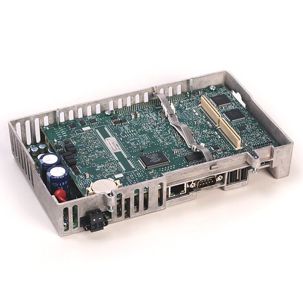 Allen-Bradley PLC module, a green circuit board with various electronic components inside a metal casing.
