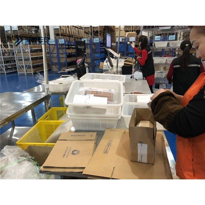 Warehouse operations, Radwell International employees preparing Allen-Bradley PowerFlex 4 AC drives for shipment.