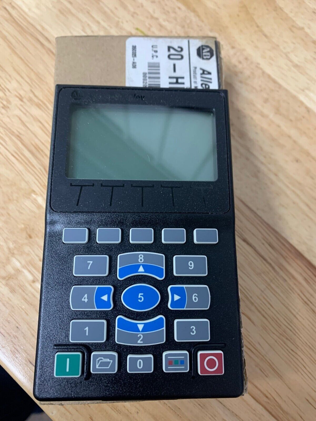 Allen-Bradley 20-HIM-A6 PowerFlex module with keypad and LCD for drive control.
