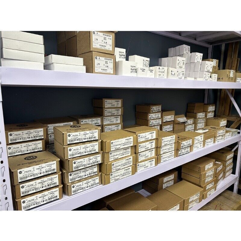 Allen-Bradley PLC modules and automation parts boxes on shelves