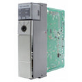 Allen-Bradley SLC 5/04 CPU. Gray metal enclosure with RUN, FLT, DH+, RS232 indicators. Green circuit board.