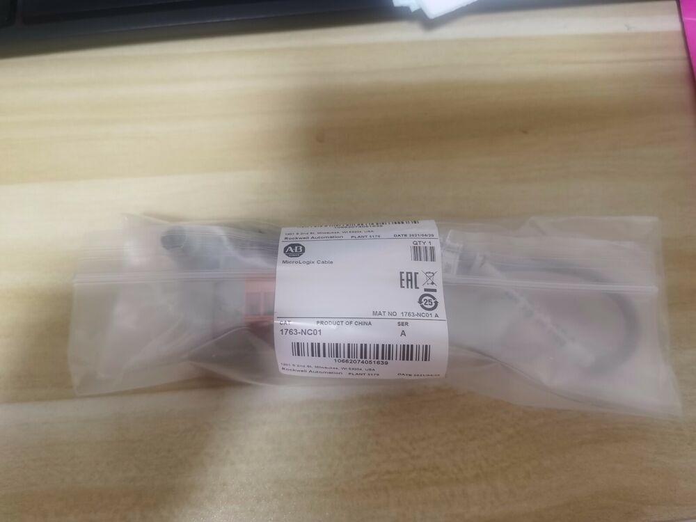 Allen-Bradley 1763-NC01 MicroLogix DH-485 Comm Cable, sealed in a transparent plastic bag, surplus product.
