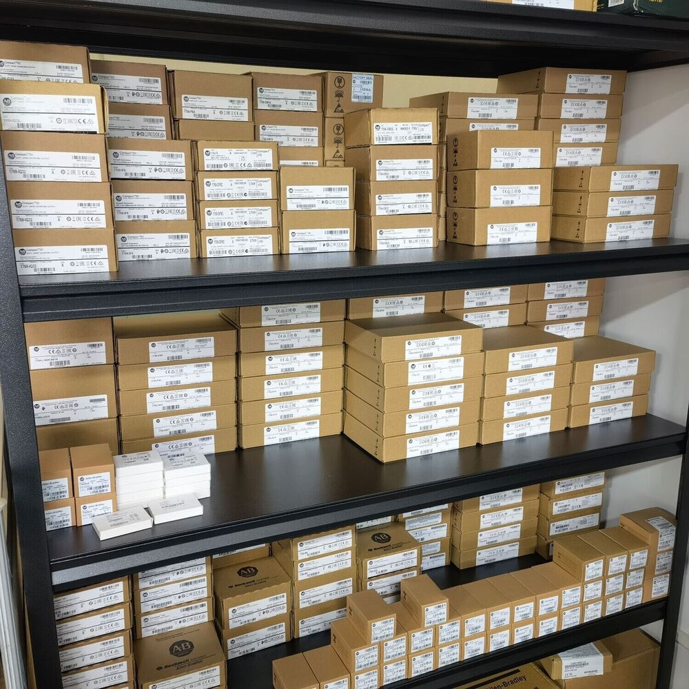 Warehouse stock of Allen-Bradley CompactLogix controllers in boxes, ready for shipping, showcasing product codes.