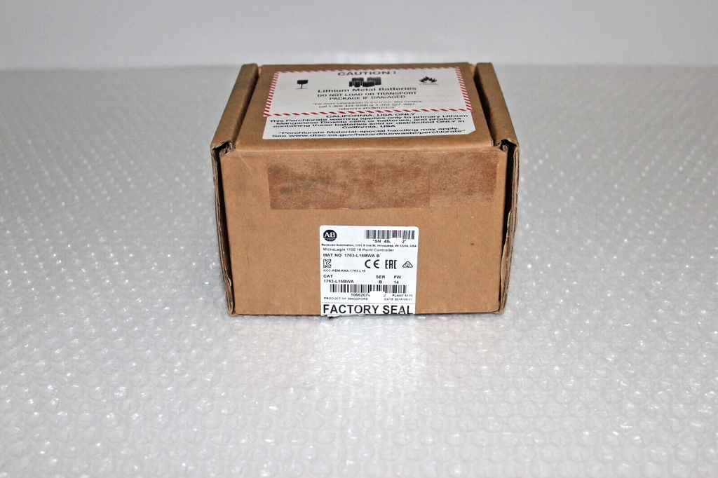 Allen-Bradley MicroLogix 1100 programmable controller in factory sealed box with warning labels, industrial automation part