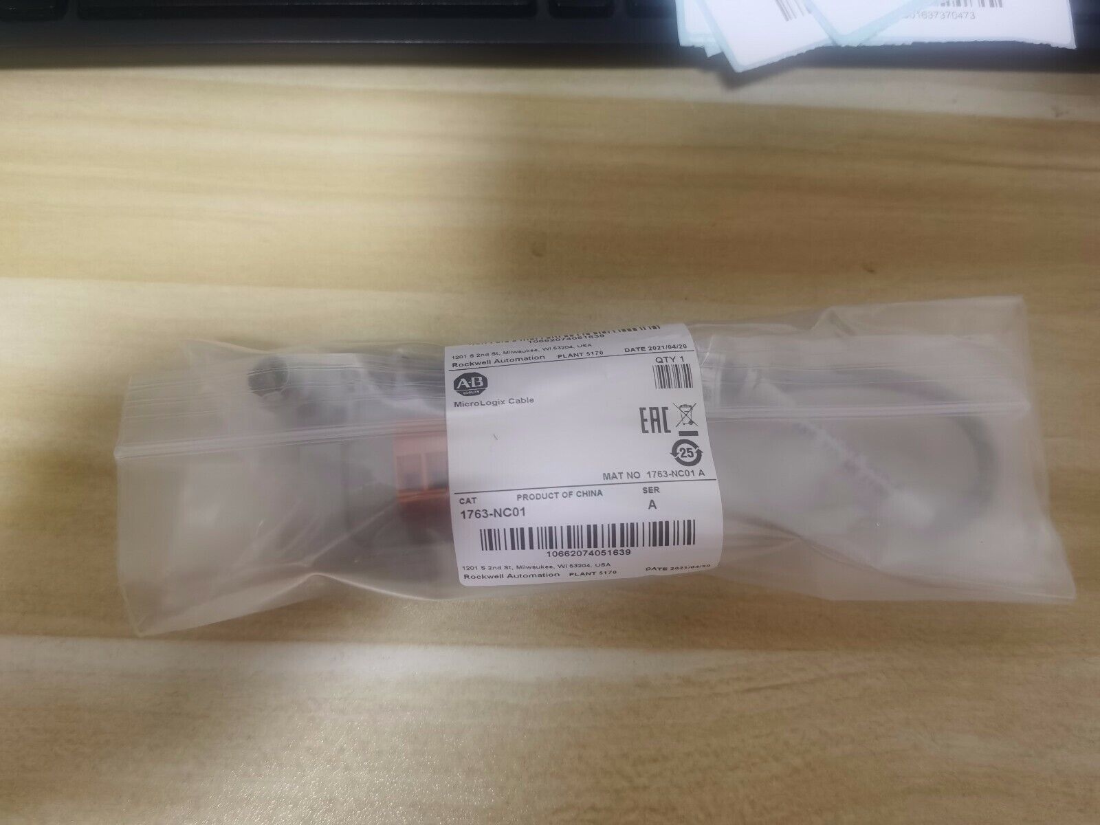 Allen-Bradley 1763-NC01 MicroLogix DH-485 Comm Cable in a sealed plastic bag, surplus product.